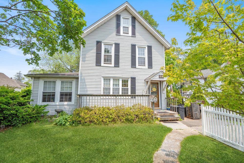 Charming Victorian era home built in 1884 is perfectly positioned on a beautiful tree lined street.
