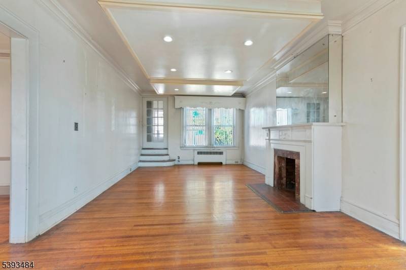 Welcome to this beautiful Colonial home nestled on quiet, tree lined Keer Avenue in Newark's sought after Weequahic section.