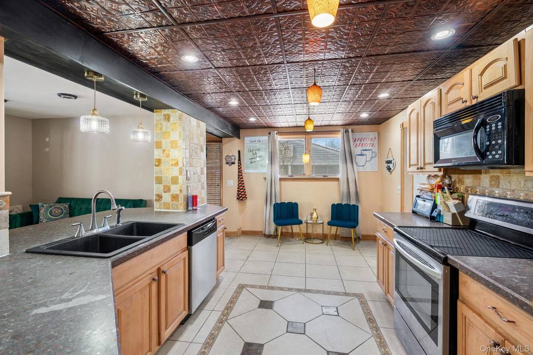 Welcome to 42 Beechwood Park, a well maintained and inviting home nestled on a quiet, tree lined street in Poughkeepsie.