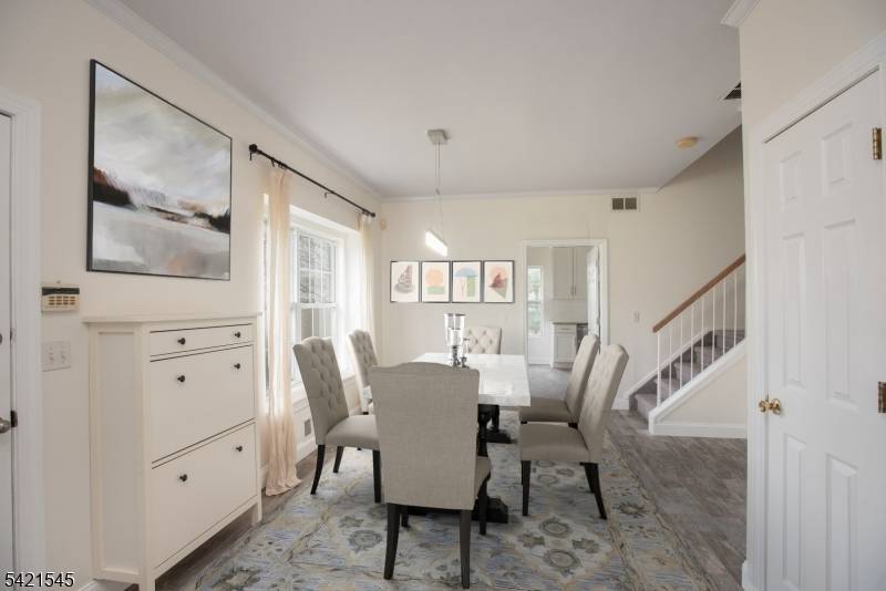 Spacious, sun filled end unit townhome in desirable Tallwoods, Green Brook.