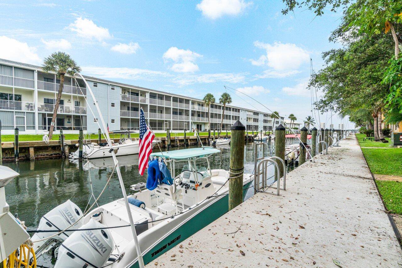 Welcome Home to Your Beautiful, Fully Renovated 2 bedroom, 2 bath, 1 Car Garage, First Floor Condo with Assigned Boat Dock !