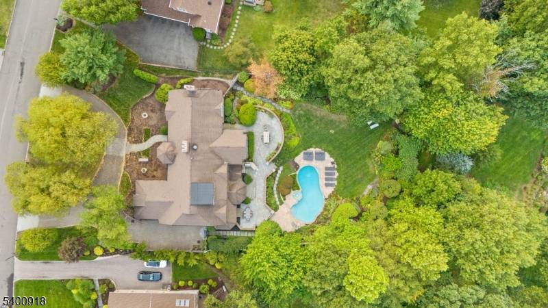 Experience resort style living in this exceptional North Caldwell residence, where timeless craftsmanship meets modern luxury.