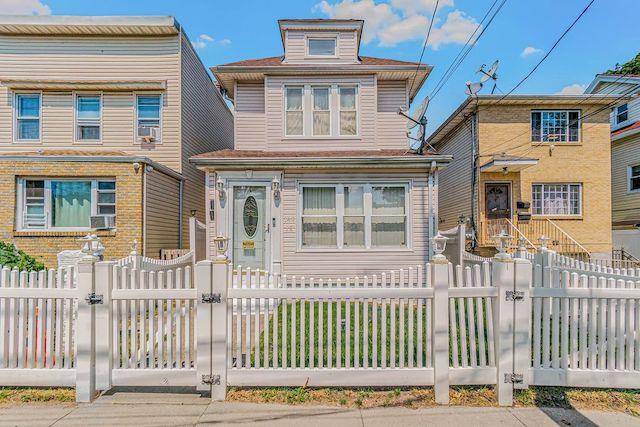 Single family home, detached on a fenced large lot.