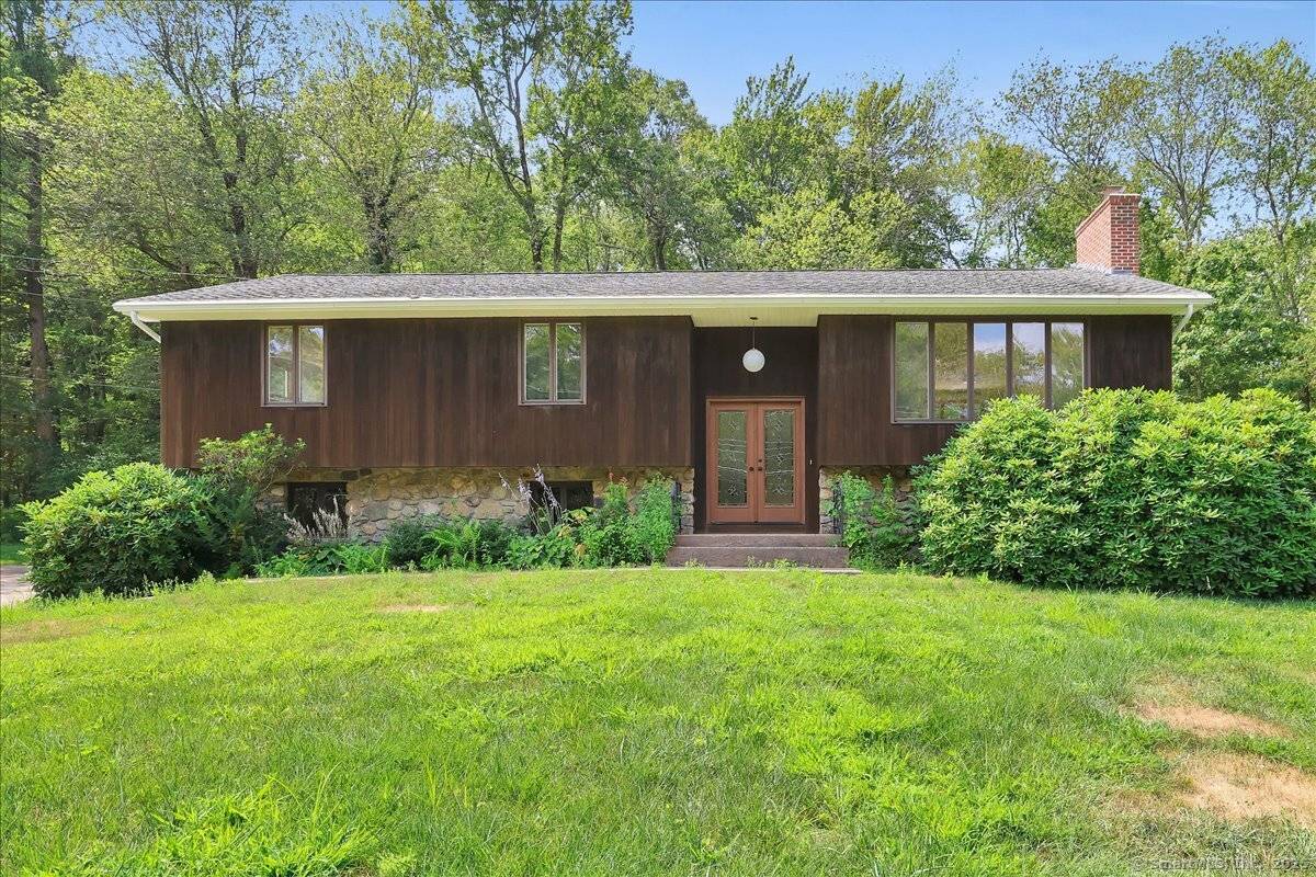 3 bedroom 2 1 2 bath Raised Ranch in a quiet neighborhood on a level, lightly wooded lot.