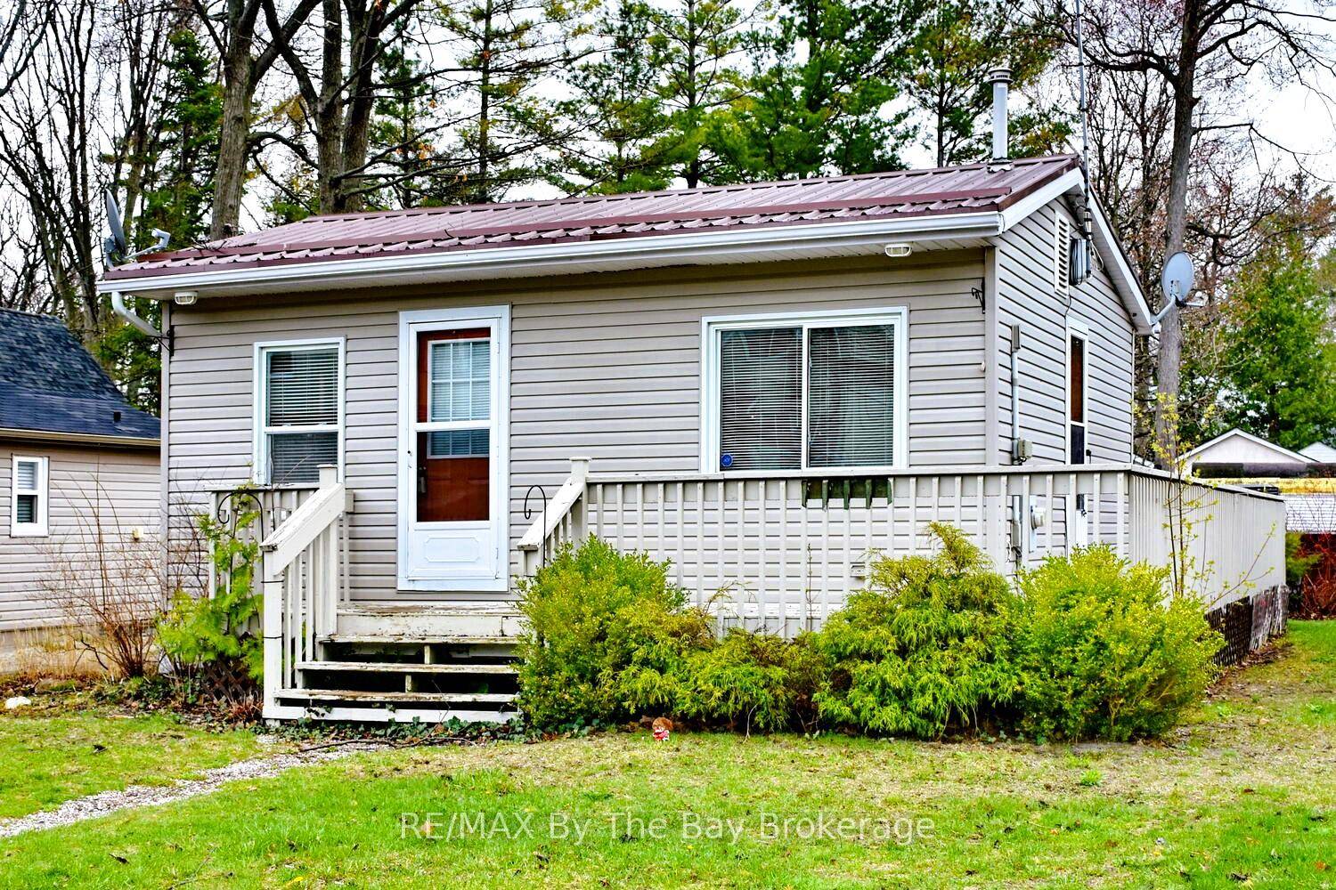 Welcome to this charming, year round retreat just steps from the sandy shores of Wasaga Beach, close enough to hear the waves from your front deck !