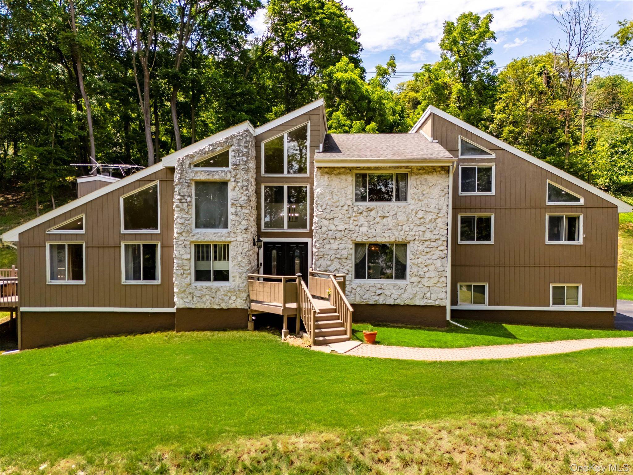 Proudly offered by the original owners, this gorgeous colonial sits on 2 private acres with beautiful river views.