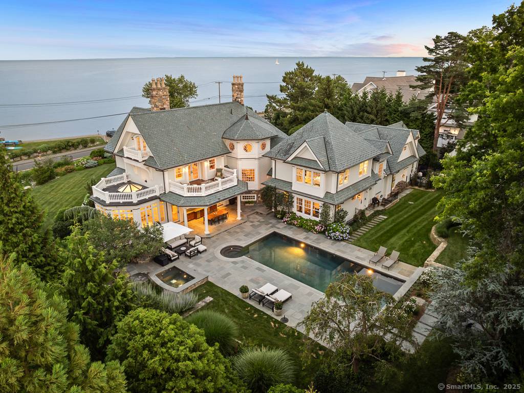 Experience the unparalleled luxury of this exquisite Compo Beach seaside home, a masterpiece of design and craftsmanship, designed by renowned architect Peter Cadoux.