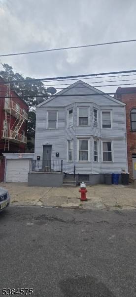 2 family house located in the McGinley Square 5 bedroom with 2 bathroom seperate heat and hot water Sold as is condition.