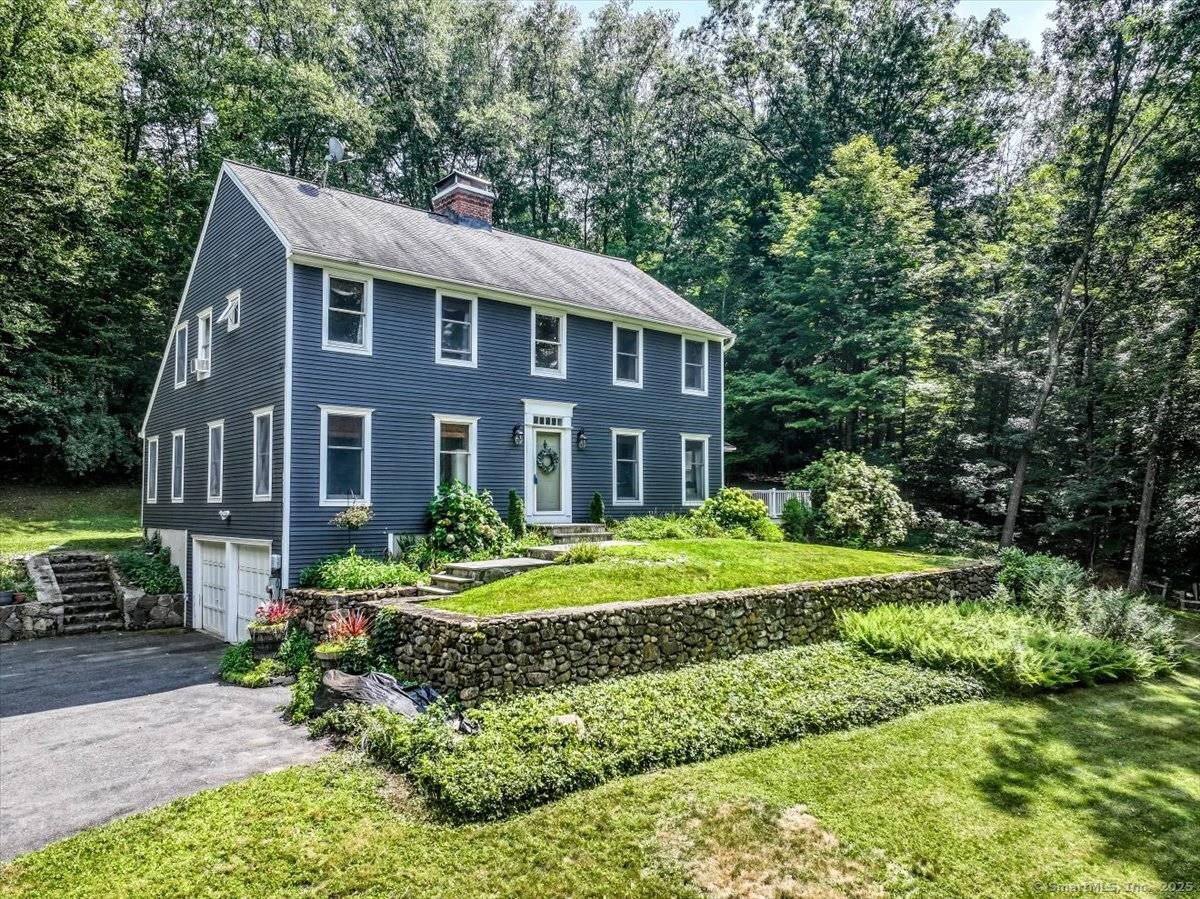 Nestled in a serene, wooded setting just minutes from beautiful Jackson Cove Town Park, this charming 3 bedroom Saltbox blends classic New England style with comfortable living spaces.