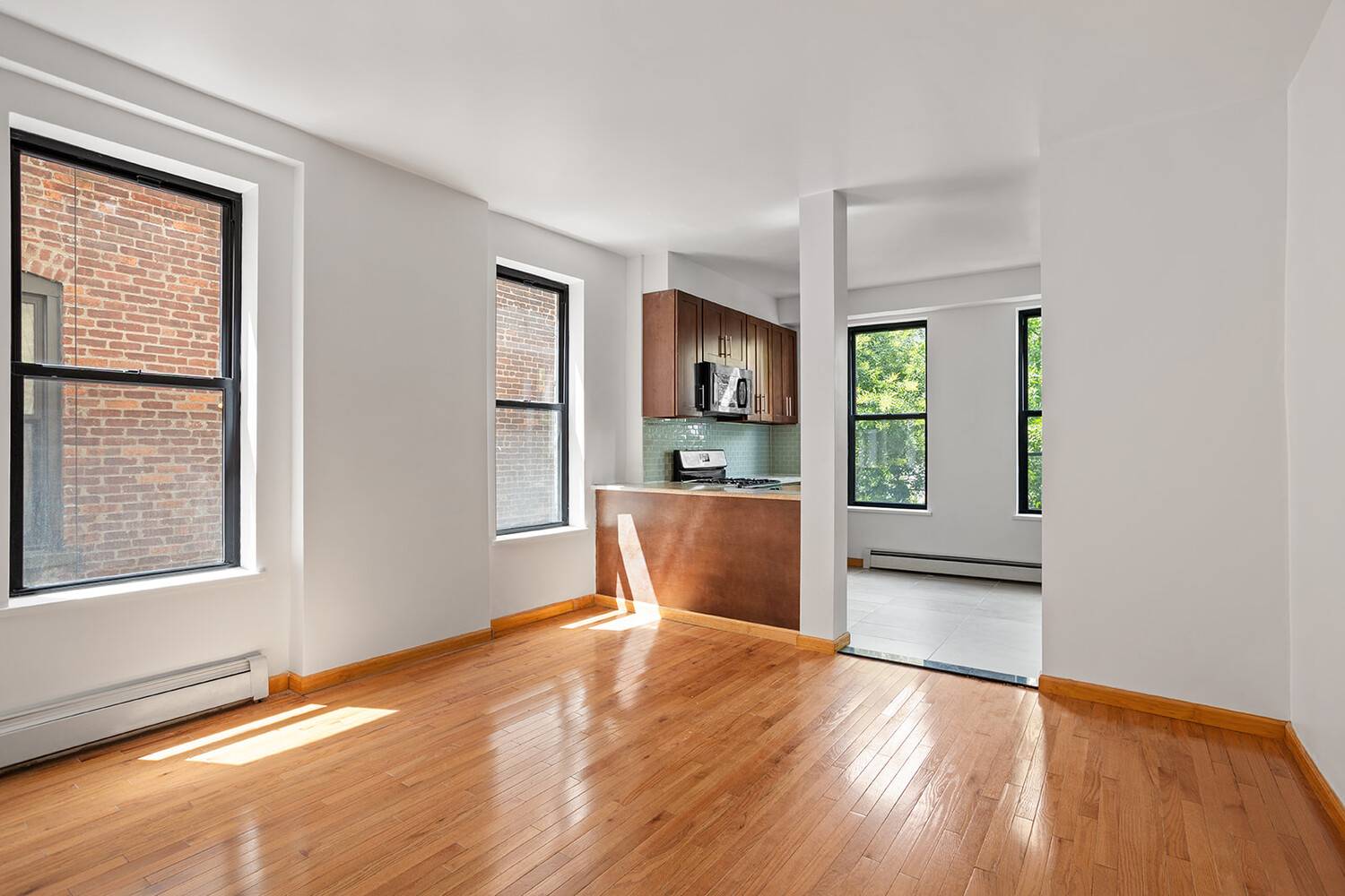 This freshly renovated gem features all new windows, two full brand new bathrooms, and a flexible layout use it as a true 3 bedroom or a spacious 2 bedroom office.
