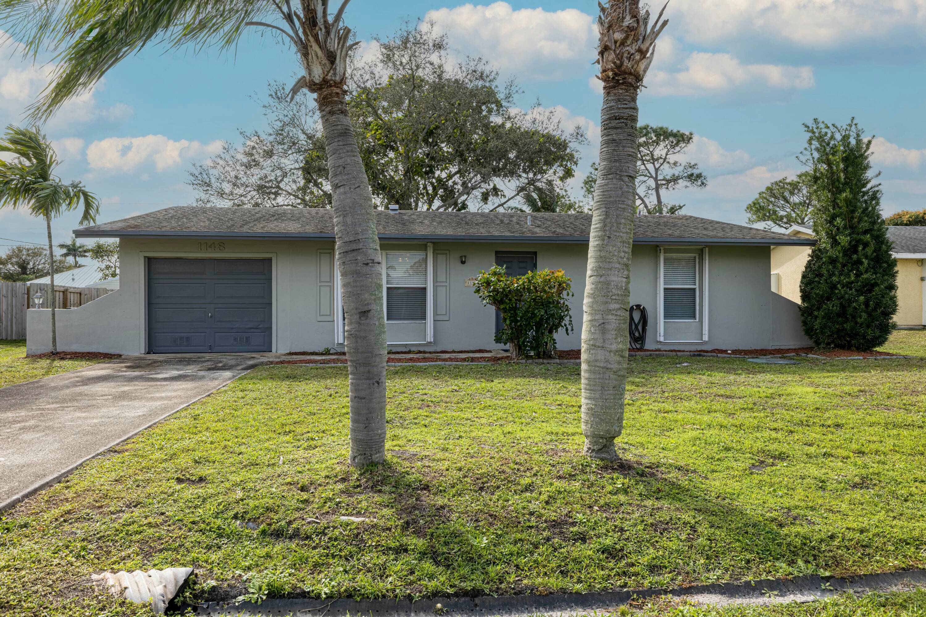 This charming two bedroom, two bathroom home features an extra room off the kitchen that can be utilized as an office.