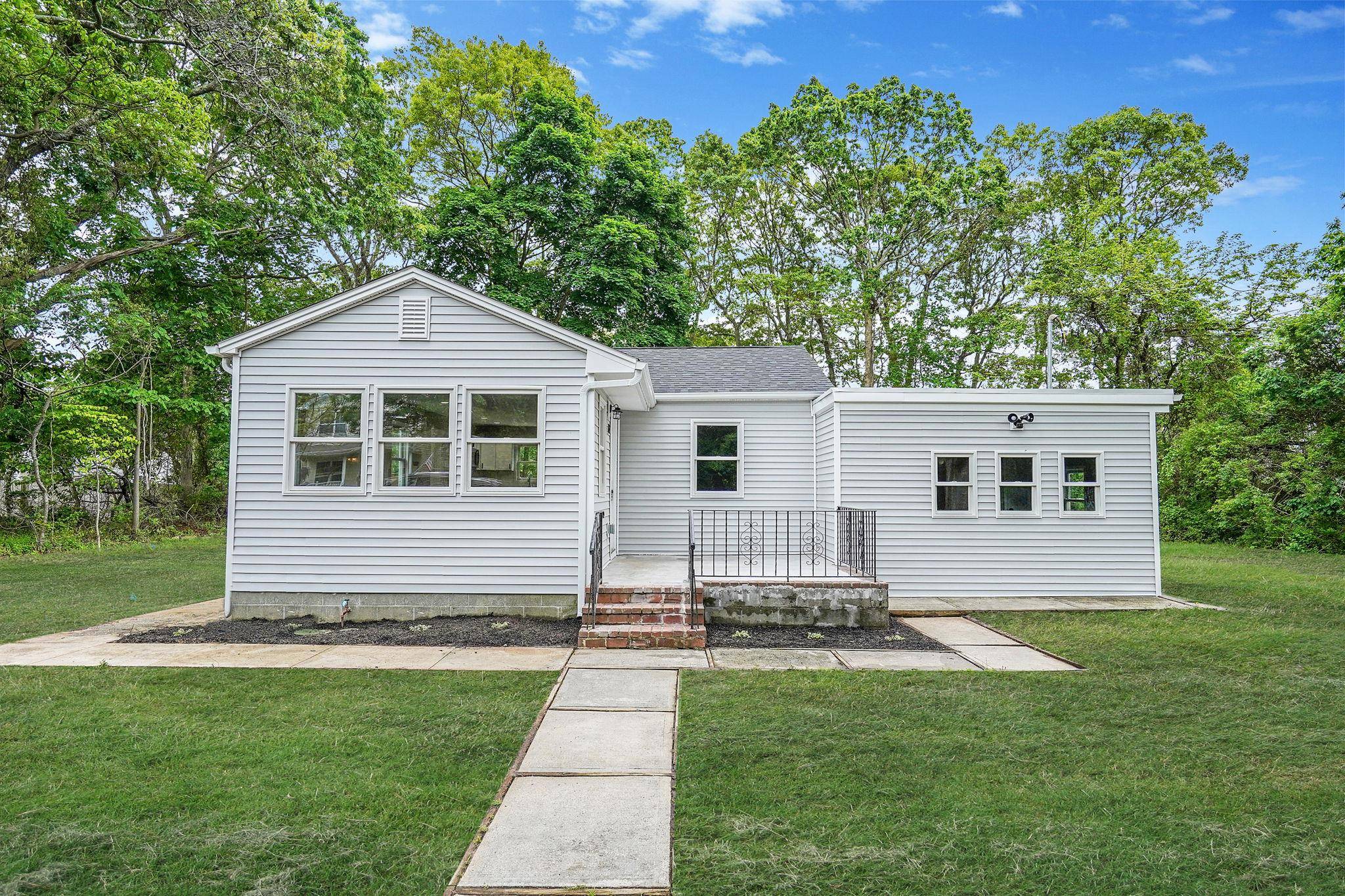 Enjoy your summers with this Lovely updated ranch located down the block from the Shirley beach and a 5 minute ride to smith point beach.