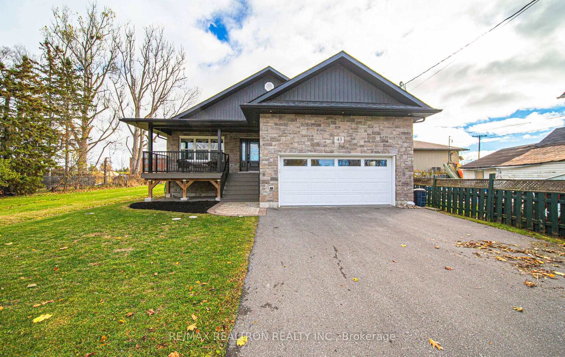 STUNNING ALL BRICK CUSTOM BUILT RAISED BUNGALOW LOCATED IN THE CHARMING COMMUNITY OF NORWOOD.