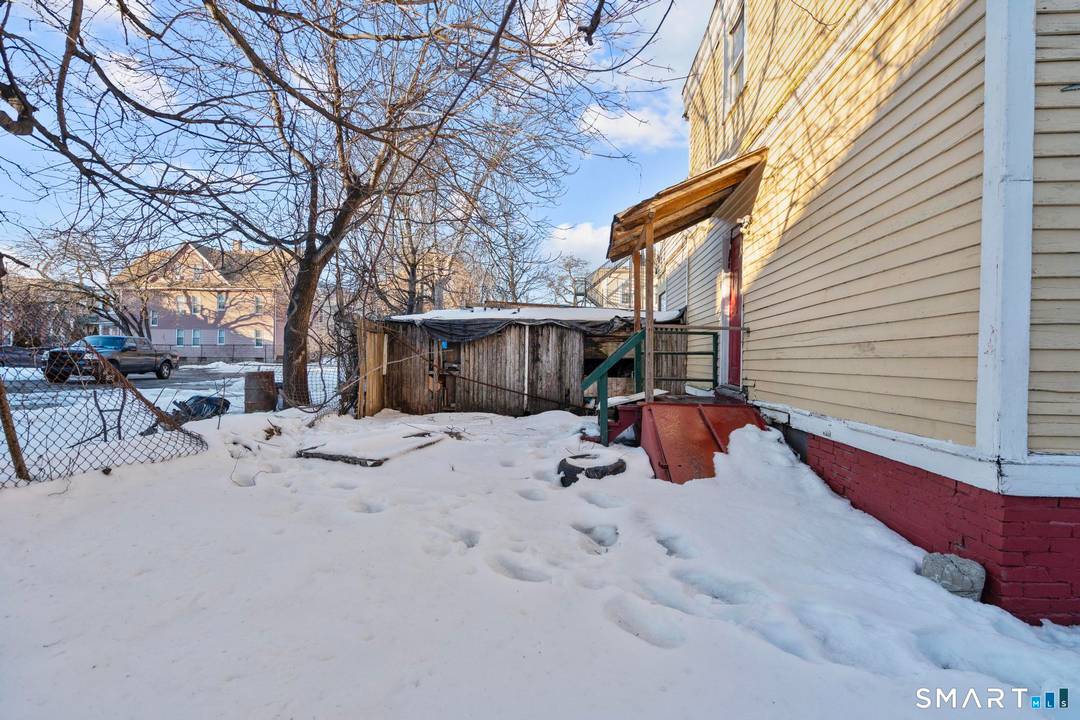 Spacious side by side two family home featuring formal living and dining rooms, fireplace, jacuzzi, and abundant closet space throughout.