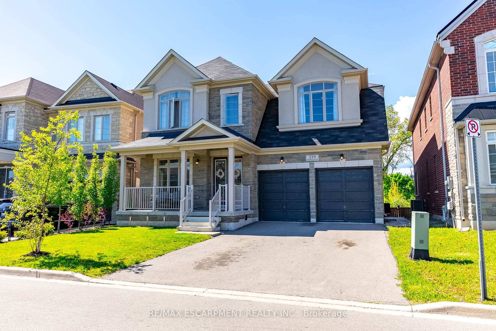 Welcome to 219 Humphrey Street an exceptional executive residence in the heart of Waterdown, beautifully set against a tranquil ravine backdrop.