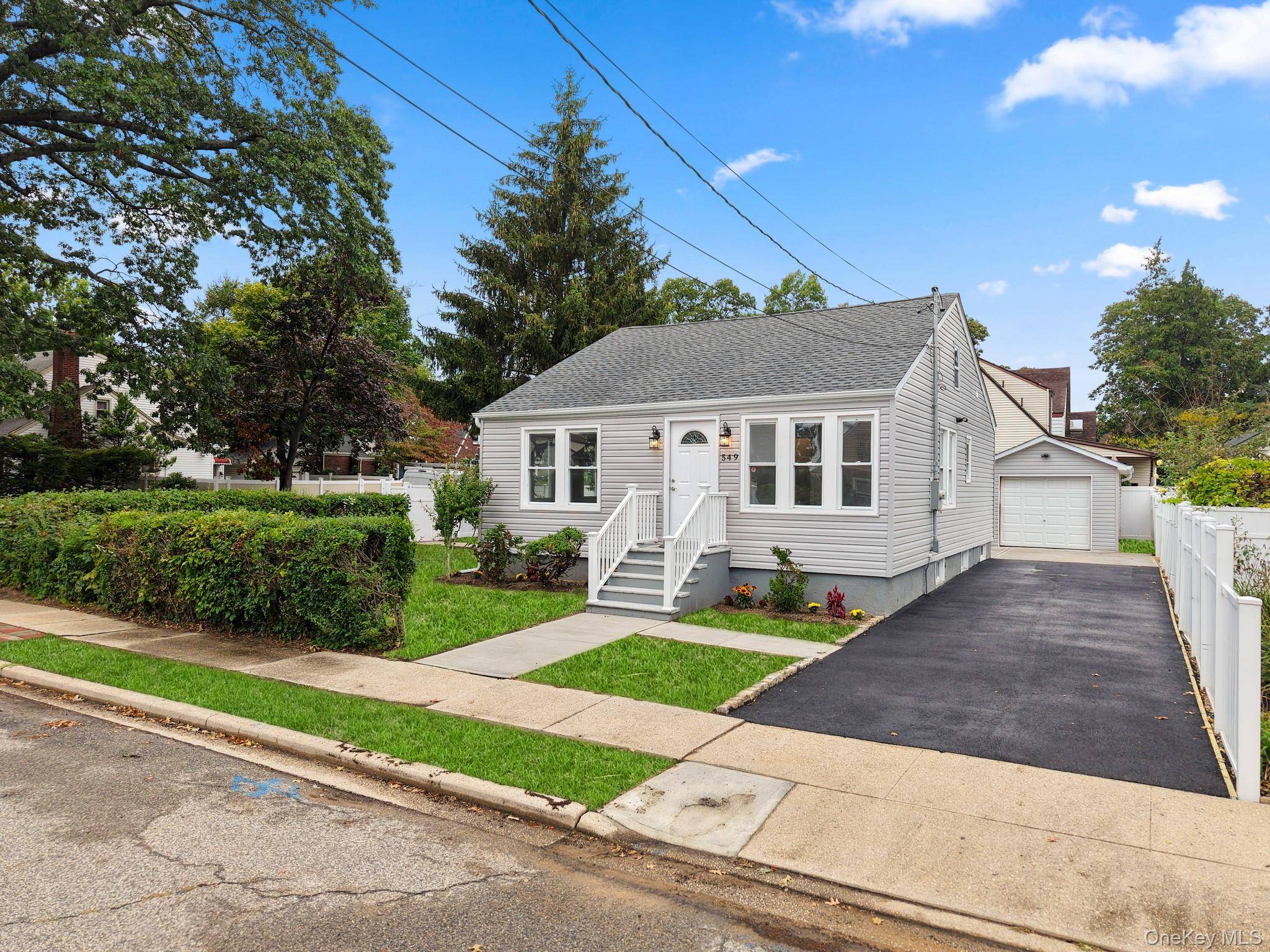 Welcome to this adorable bungalow located on a corner lot in Baldwin.