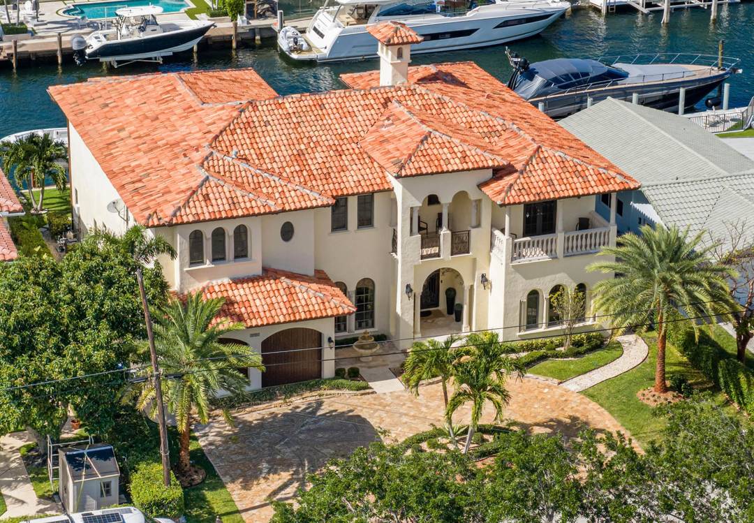 Stunning luxury waterfront estate, showcasing Mediterranean elegance with timeless architecture, modern lighting, and refined details throughout.