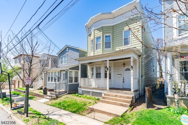 LEGAL TWO FAMILY WITH TONS OF POTENTIAL !