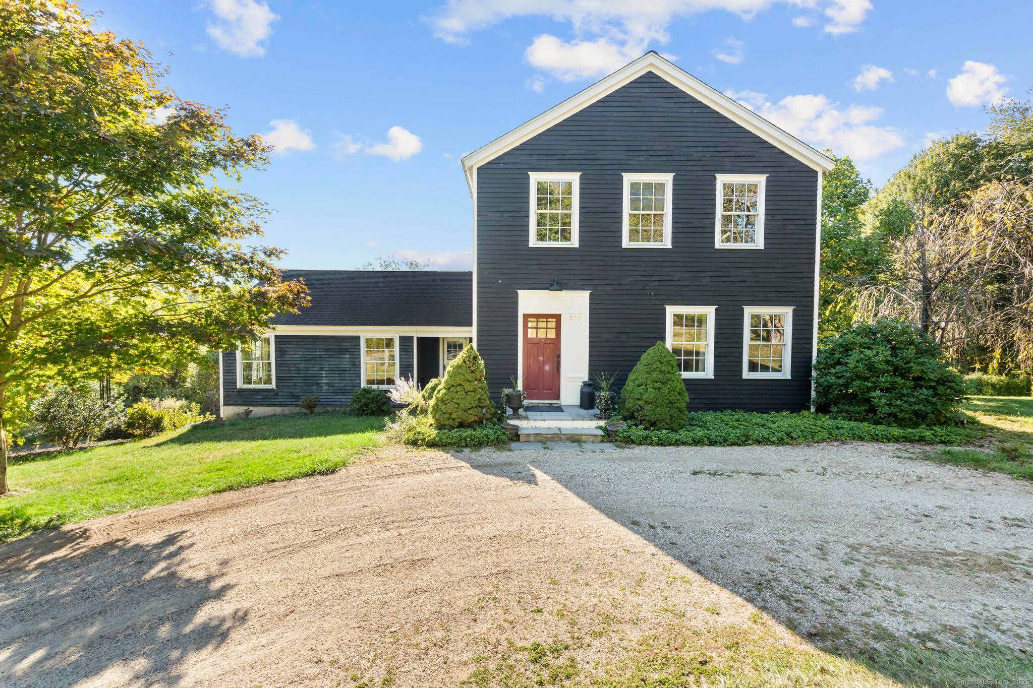 Step into this classic farmhouse charm with the clean lines and thoughtful proportions of this architect designed colonial, built in 2004 and on approximately 2.