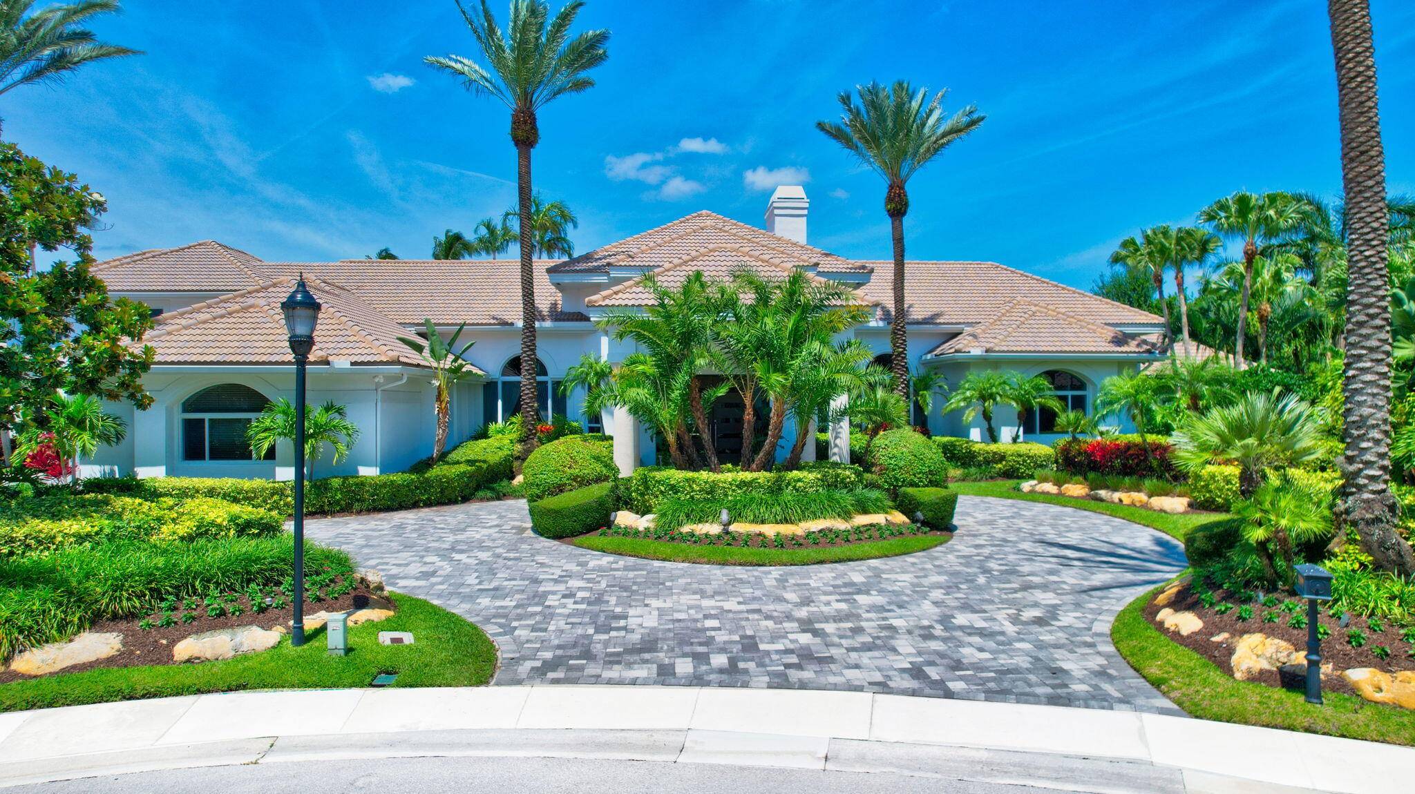 MAGNIFICENT DOUBLE LOT ESTATE SITUATED ON 284' OF PRISTINE WATERFRONT IN GRAND OAKS AT BROKEN SOUND COUNTRY CLUB !