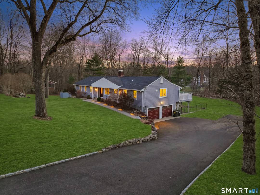 North Stamford ranch set on a quiet cul de sac offering one level living with a sun filled walk out lower level and private outdoor spaces.