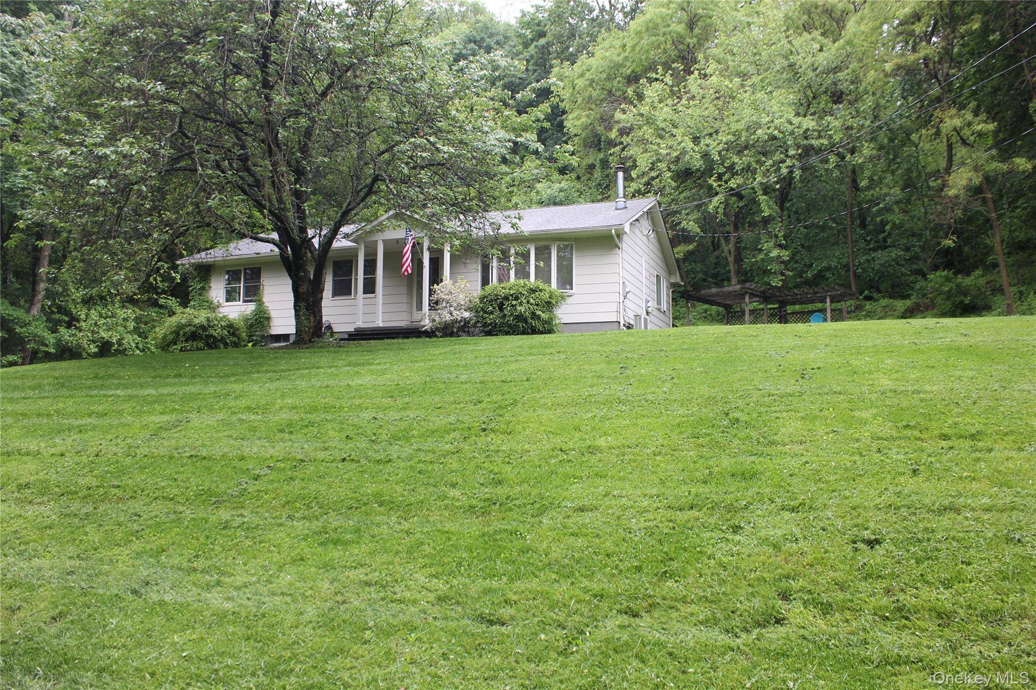 Welcome home to this charming 3 bedroom, 2 bath ranch nestled in the heart of Pine Island !