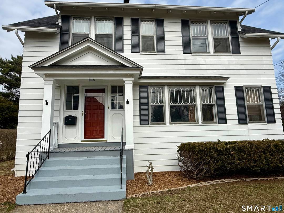 Beautiful colonial with exquisite Custom Woodwork and Built ins !