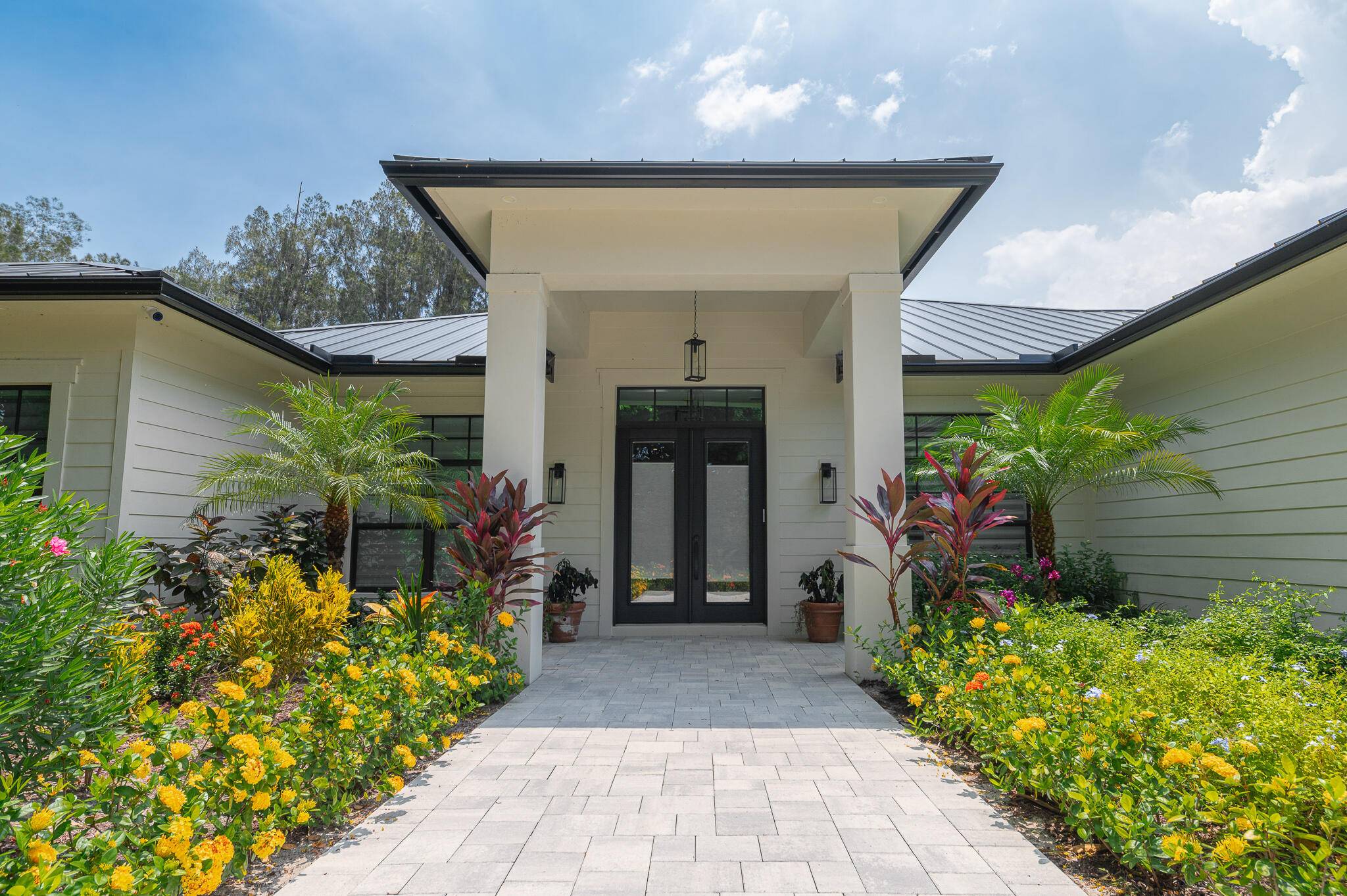 Nestled by the ''Banyan Tree Tunnel, '' this single story masterpiece is tucked into lush Banyan Tree Estates.