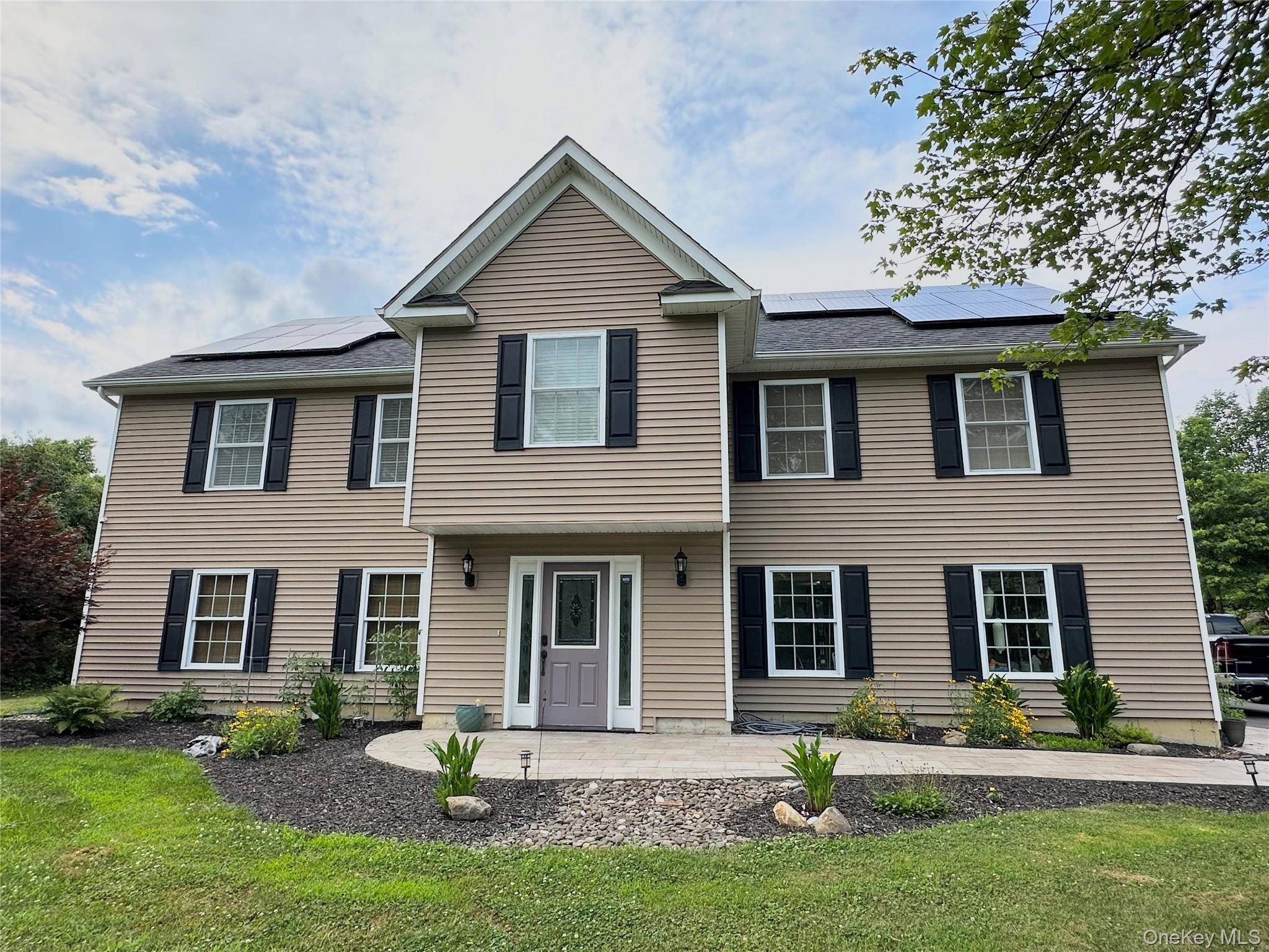 This home comes equipped with solar panels, keeping your electricity bills incredibly low year round.