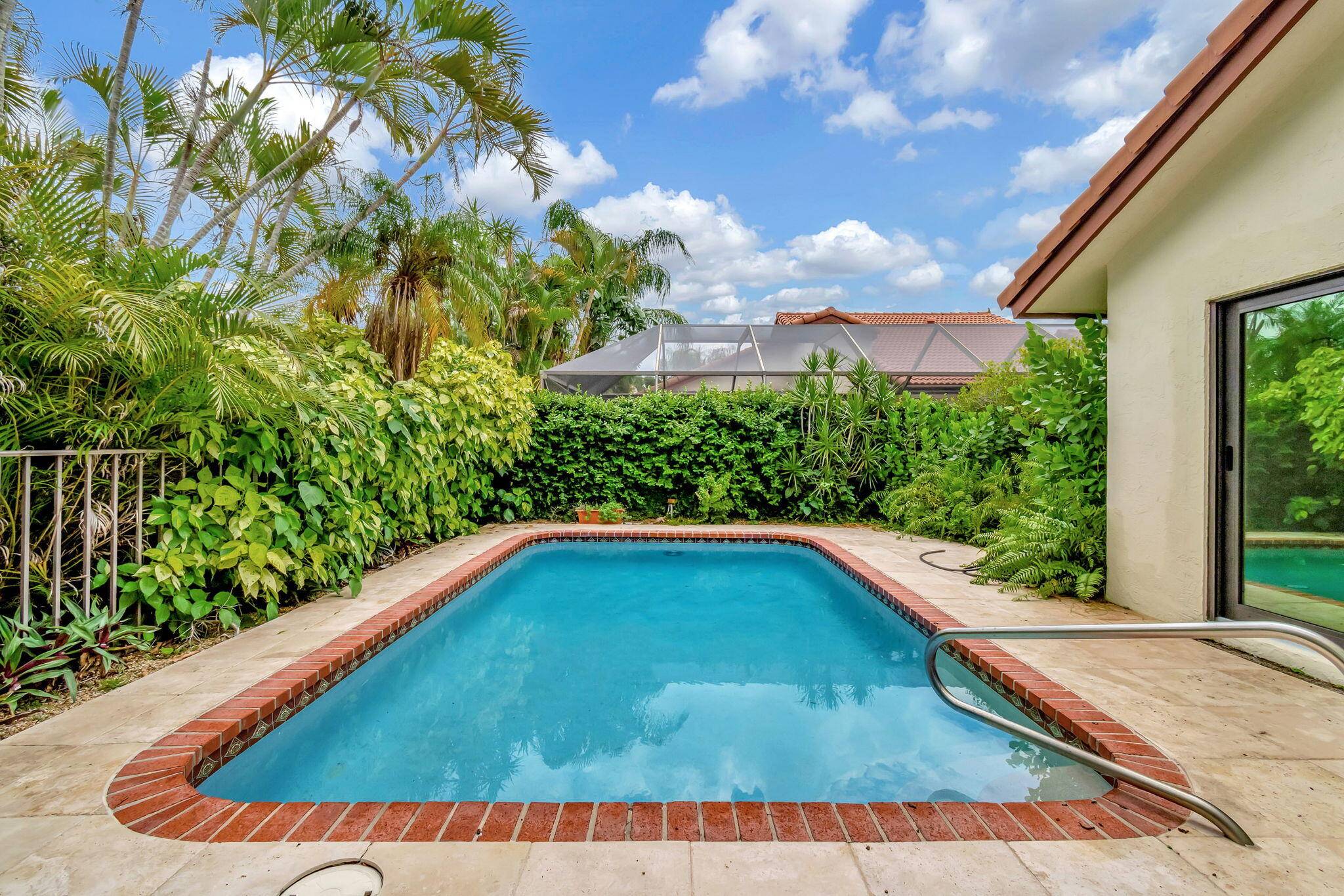 4 2 home on a corner lot located in central Boca Raton.