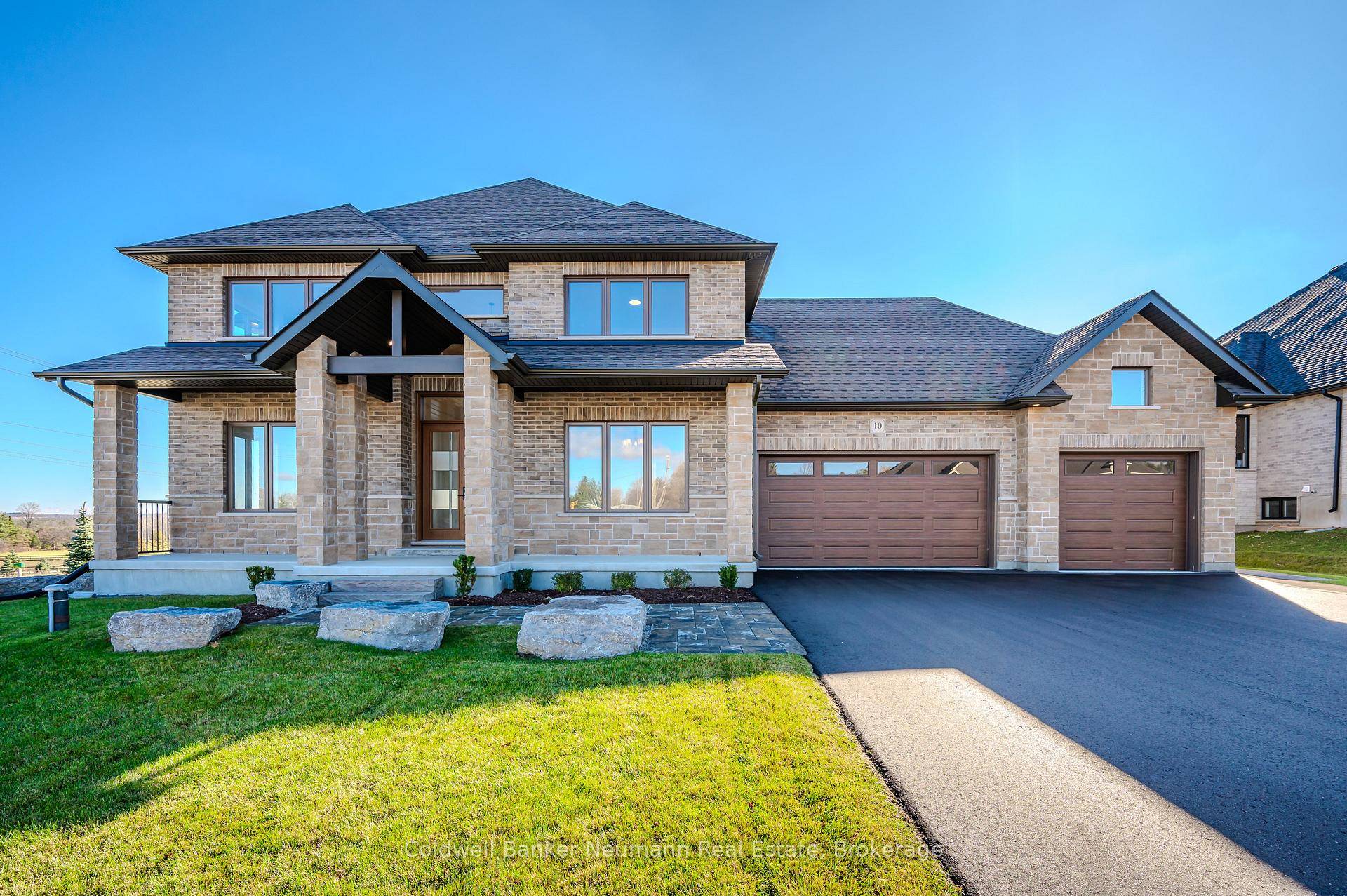 Beautiful new 2 storey Thomasfield Home with 3 car garage, paved driveway all on a 1 2 acre lot backing onto a pond and walking trail.