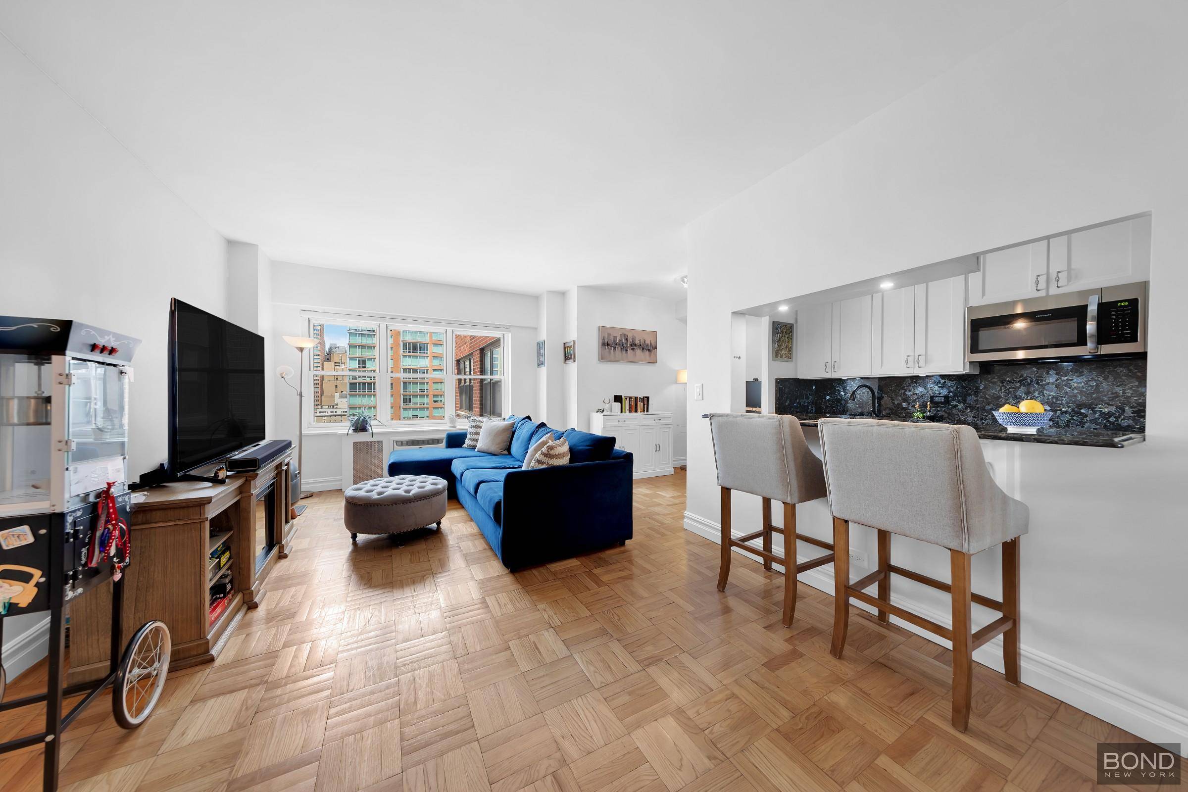 Bathed in natural light and framed by open cityscape views, this spacious one bedroom offers a refined balance of comfort and style.
