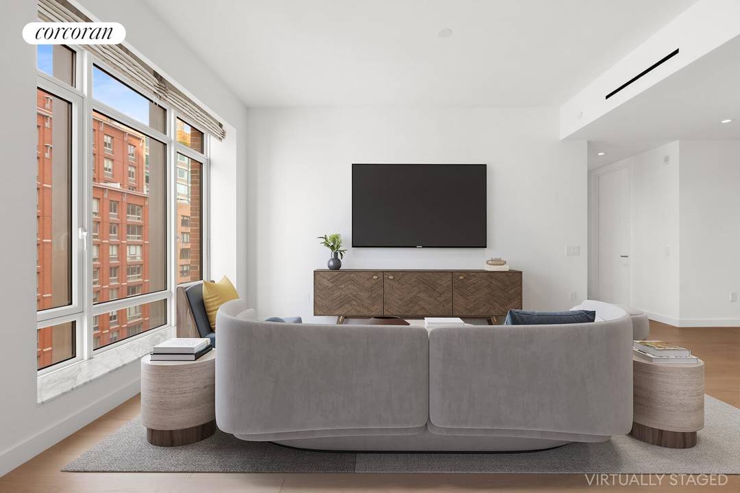 This expansive 2 bed 2. 5 bath condo has open plan living and dining areas featuring a kitchen with a custom Olson Kundig designed Jack box, warm wood flooring, and ...
