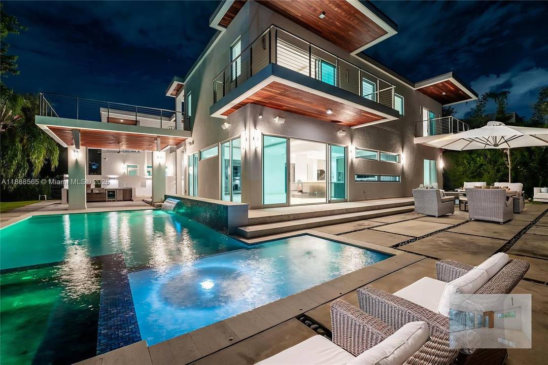 Stunning 6 bed, 6 bath estate with 10 ft ceilings, Italian marble floors, and a chef s kitchen with custom cabinetry, quartz counters, and Sub Zero amp ; Wolf appliances.