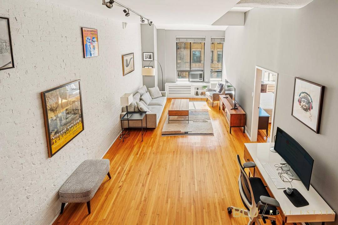 Welcome to a sunny south facing one bedroom with soaring 11 foot ceilings, exposed brick, and a loft.