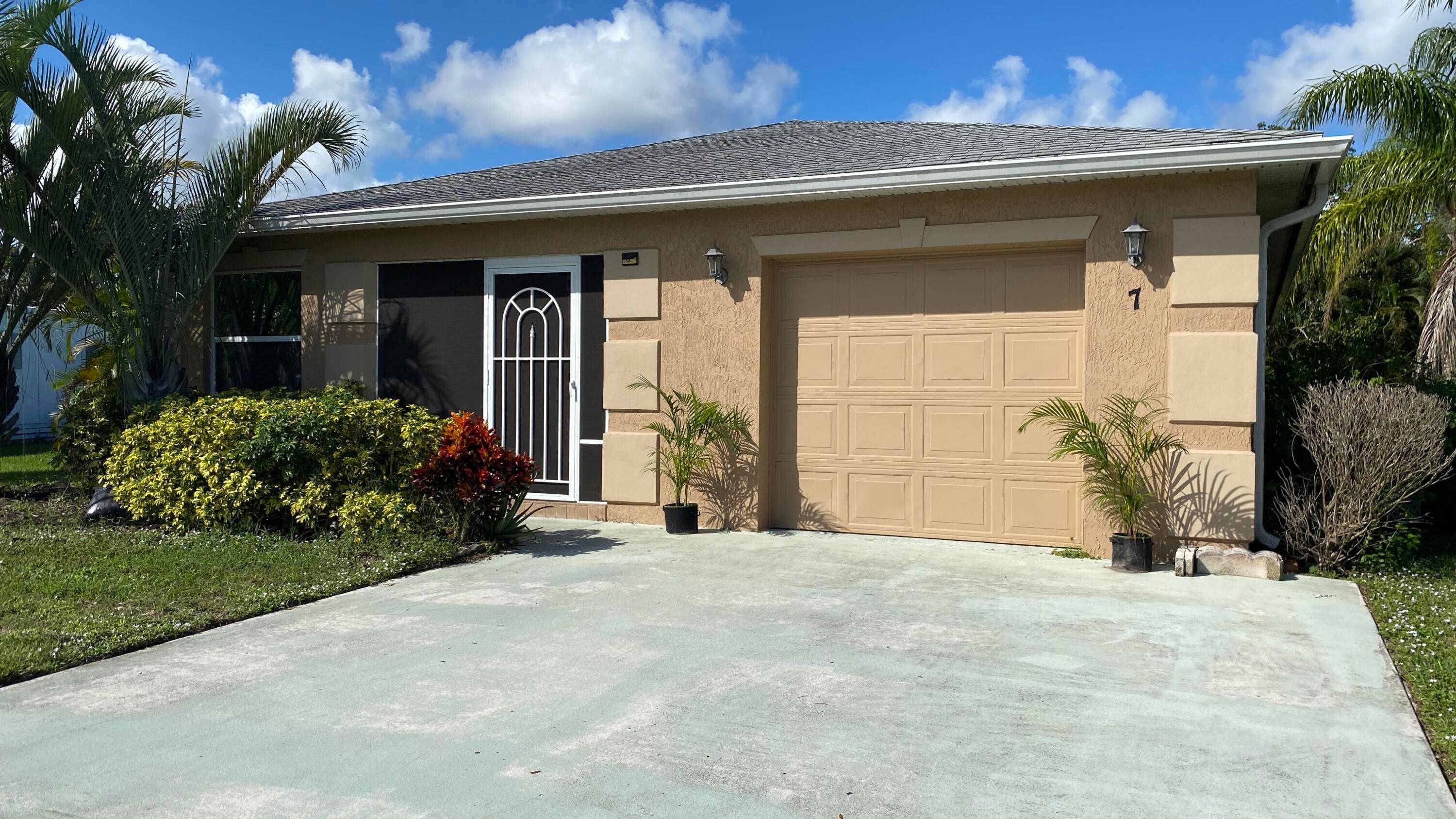 Charming home is situated in the highly sought after Spanish Lakes Riverfront community, offering a serene and active lifestyle.