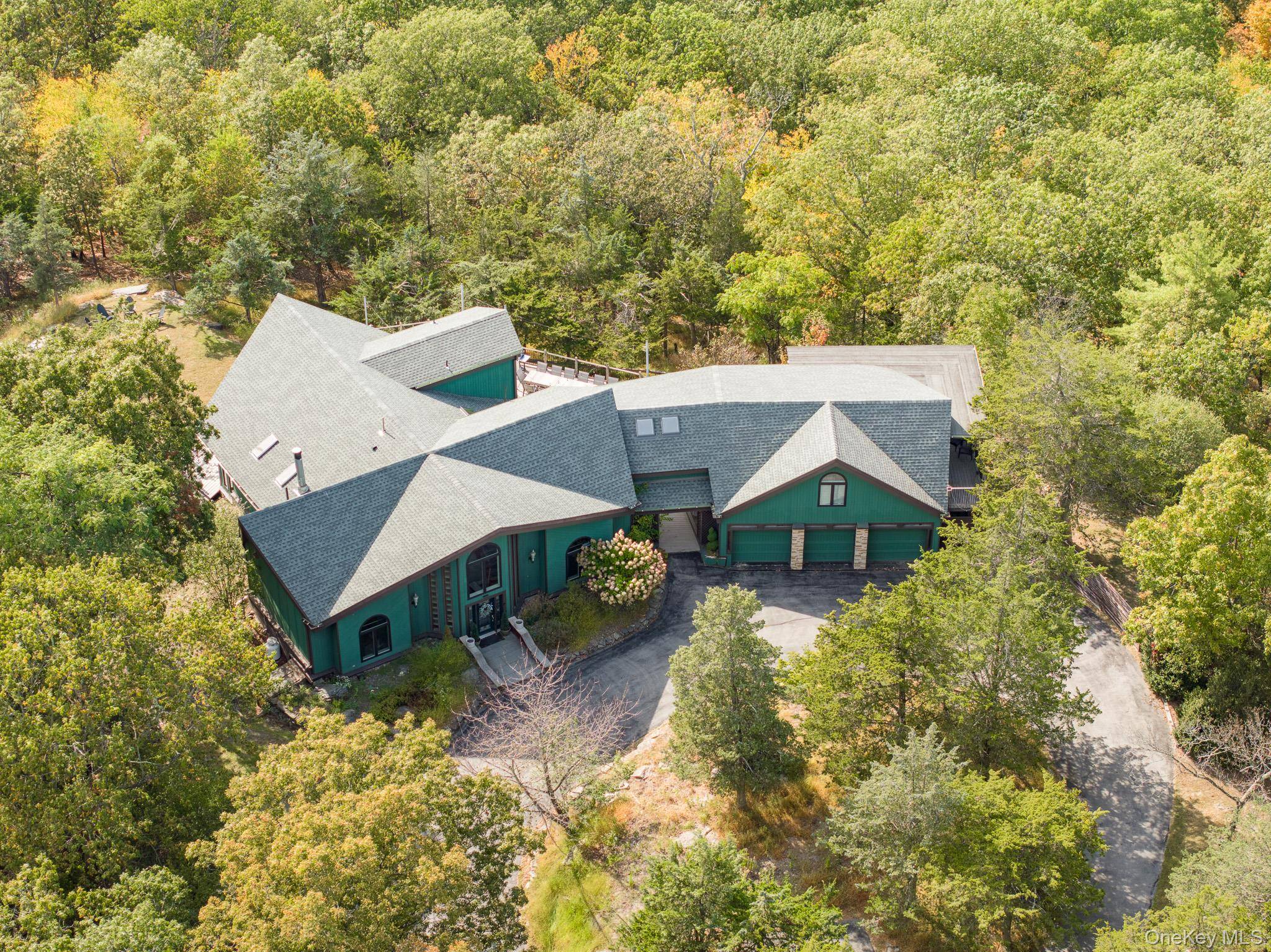 Set on 10 private acres with sweeping mountain views from nearly every room, 69 Cedar Pond is a five bedroom, eight bath estate that exemplifies expansive design and contemporary style.