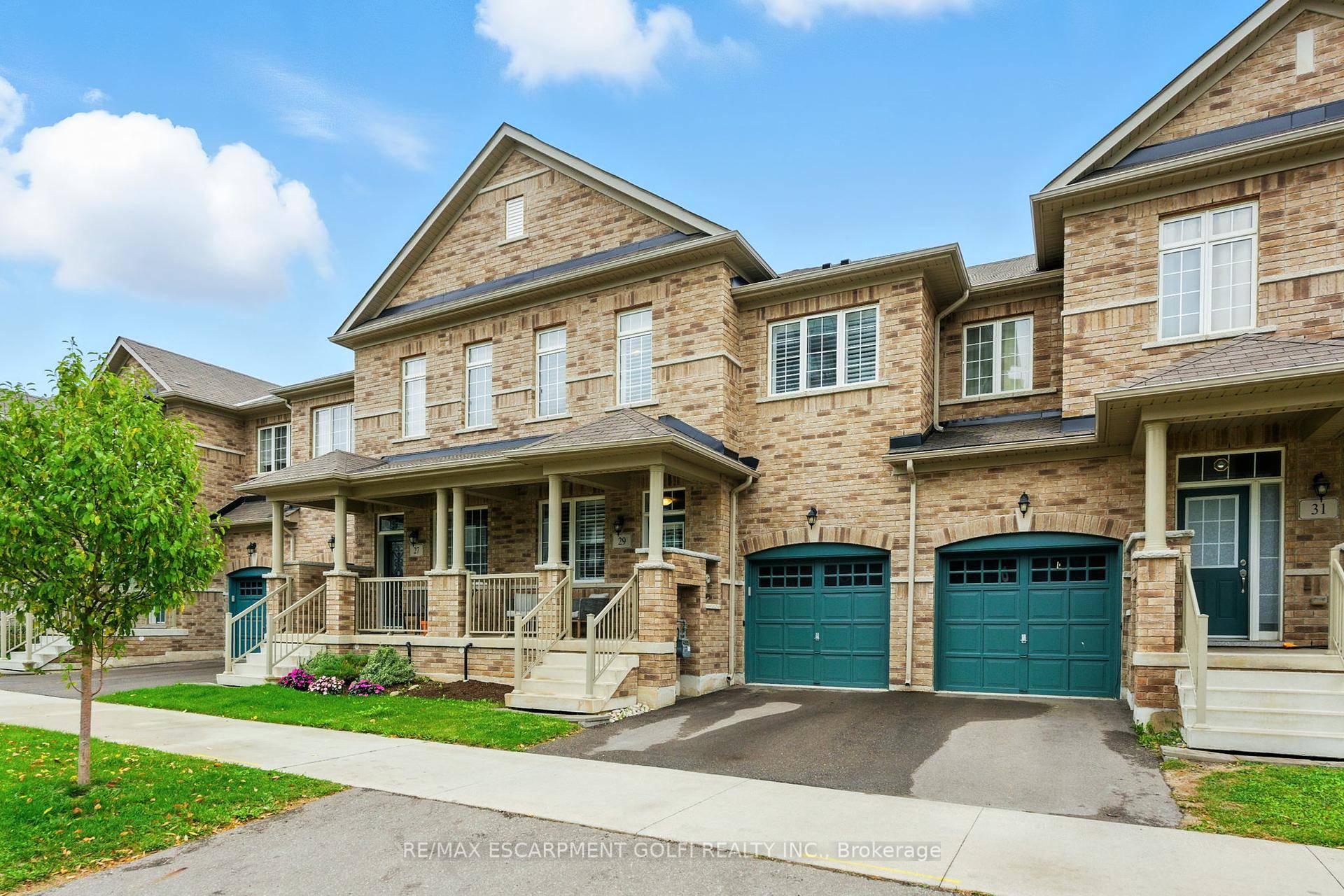 Experience refined living at 29 Riverwalk Drive a 2020 built executive freehold townhome backing onto Grindstone Creek.