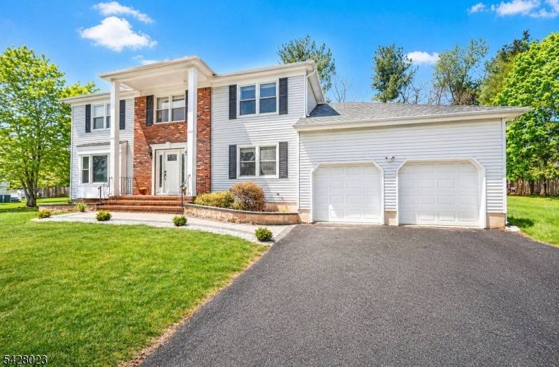 Welcome to this spacious five bedroom Colonial, ideally situated in the highly sought after Woodland Estates section of Hillsborough, New Jersey.