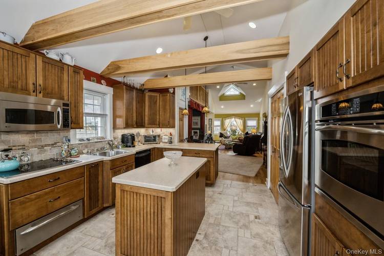 Charming Hamptons summer vacation home features open floor plan that brings in amazing natural light, spacious kitchen to prepare your favorite meals, charming dining room, large living room, 2 bedrooms, ...