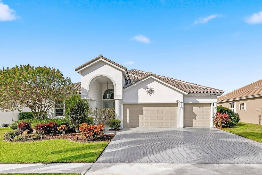 Immaculate 4BR 3BA lakefront pool home in gated Boca Falls offering 2, 348 SF under air and a 3 car garage.