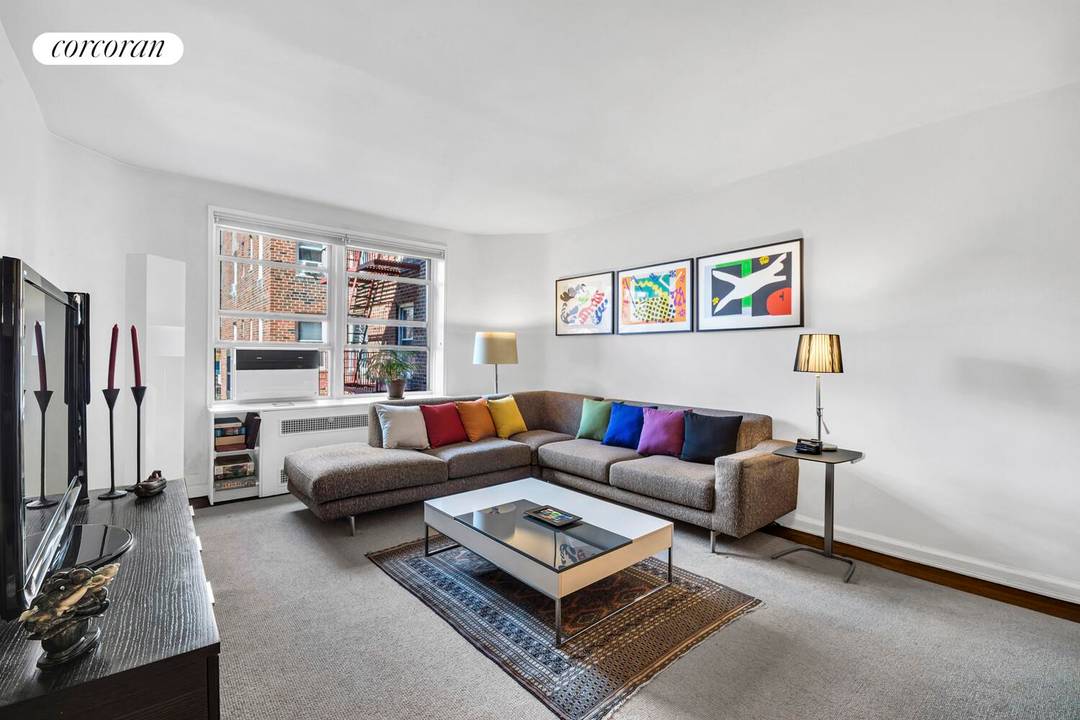 Welcome to Residence 3A at 79 10 34th Avenue, a beautifully proportioned two bedroom, two bathroom home in the heart of the Jackson Heights Historic District.