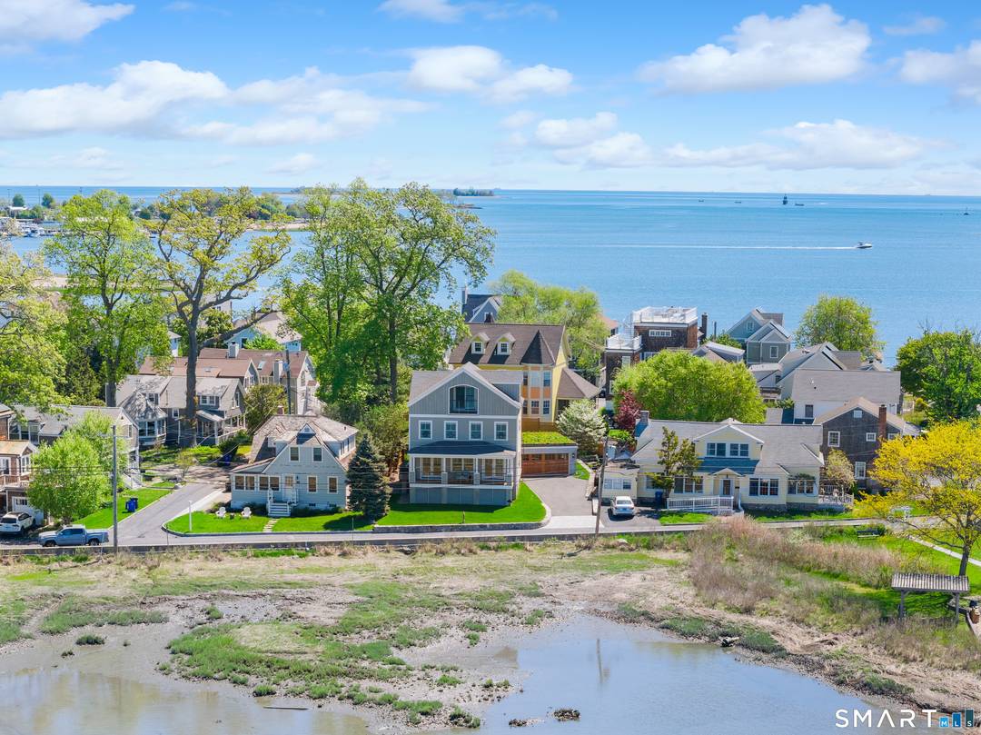 Exceptional coastal living awaits in this beautifully appointed 4 bedroom, 3 full bath retreat in the coveted Harborview community.
