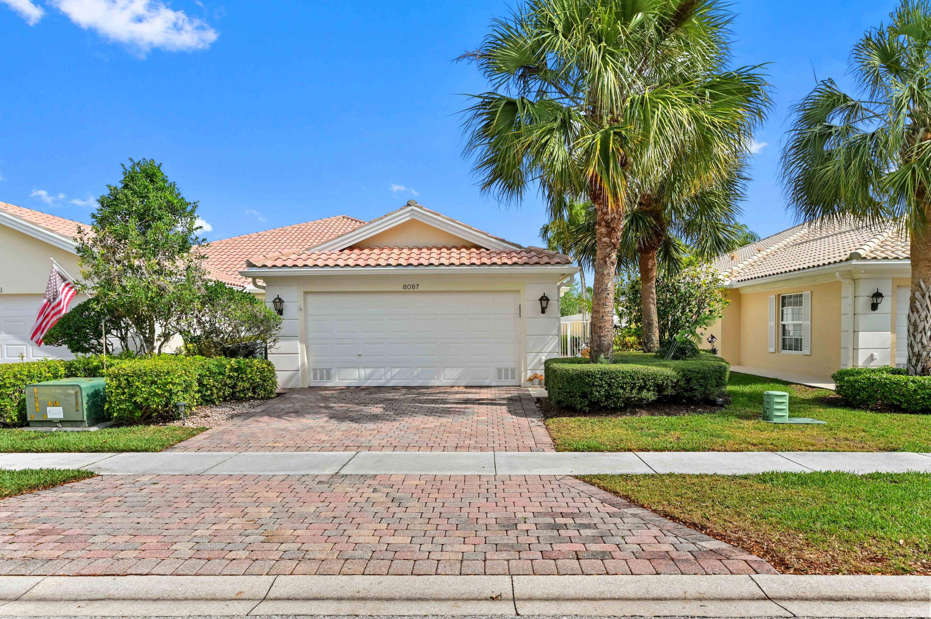 Experience resort living on this waterfront property in the Wellington community Village Walk.