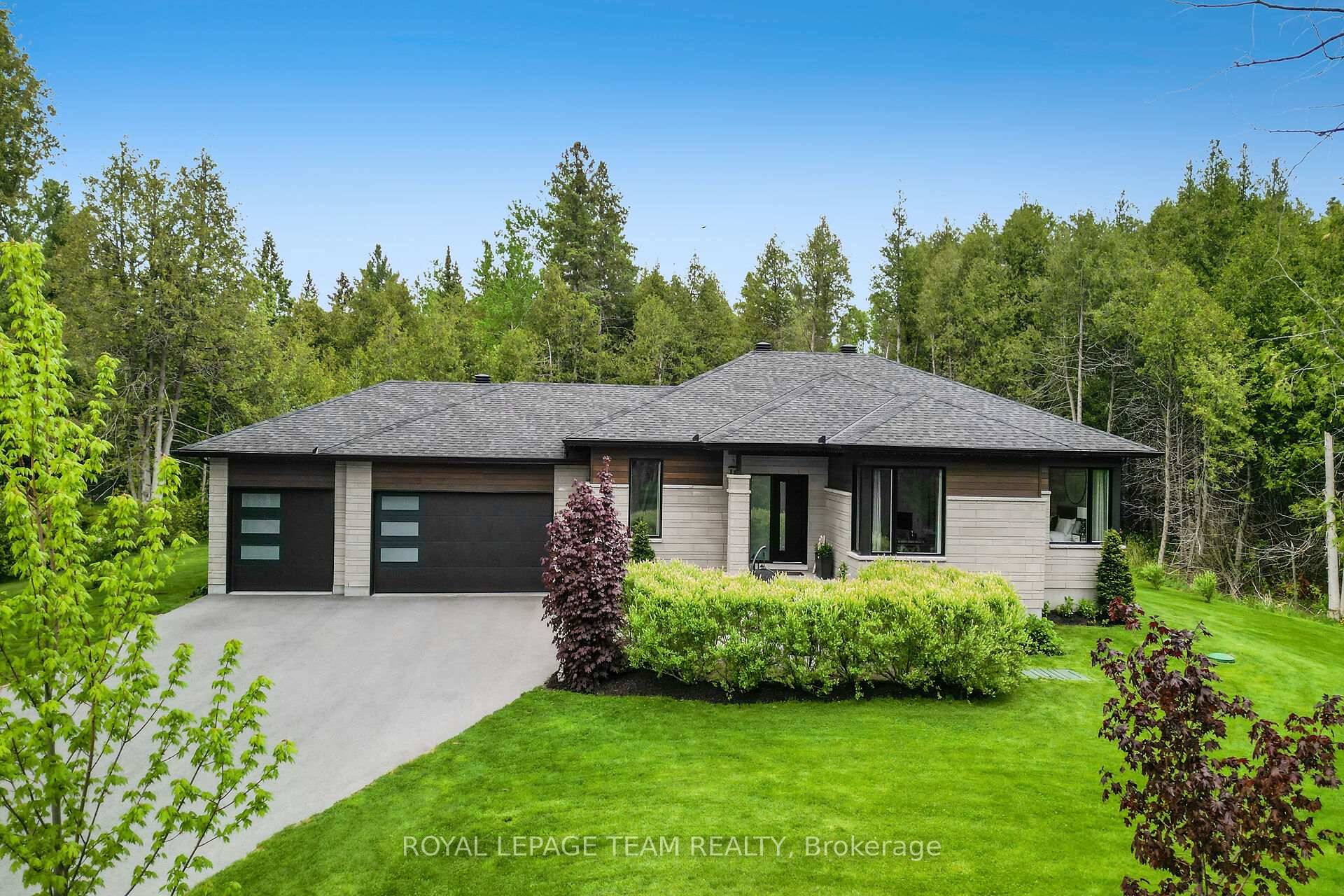 Simply stunning ! ! This spectacular 4 bedroom custom BUNGALOW W 3 CAR GARAGE is situated on one of the nicest amp ; largest treed lots in highly sought after ...