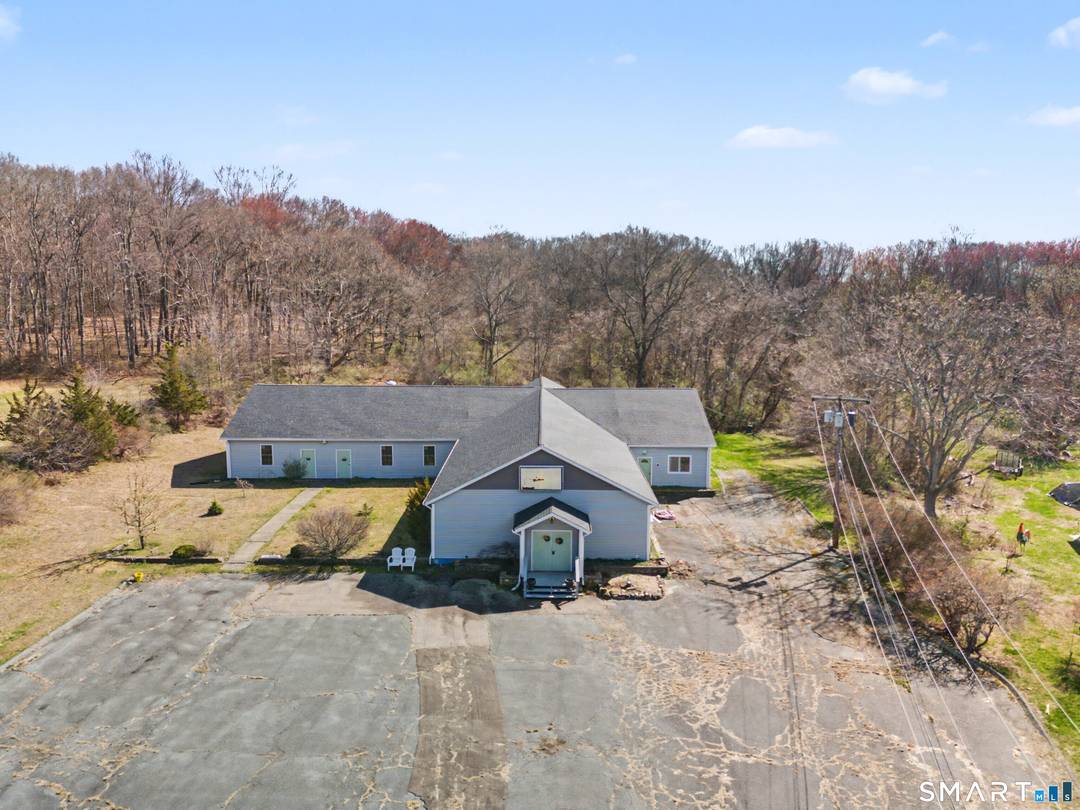 Set on 2. 56 acres, this 7, 500 square foot single story building offers a versatile layout with open gathering areas and additional office space, formally used as a place ...