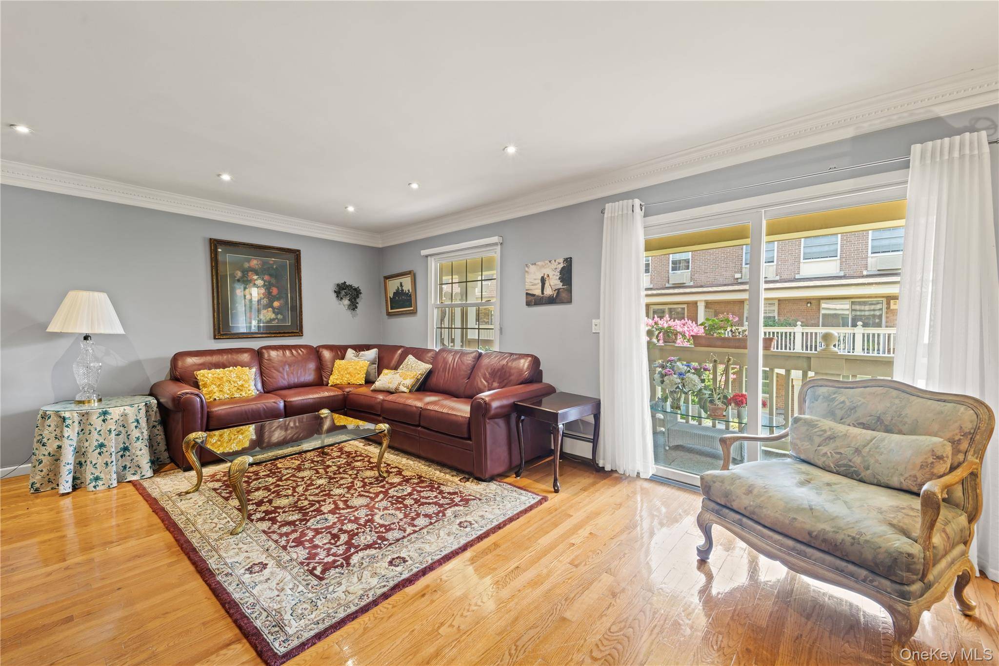This bright and inviting upper floor unit features two bedrooms and two bathrooms, providing ample space for comfortable living.