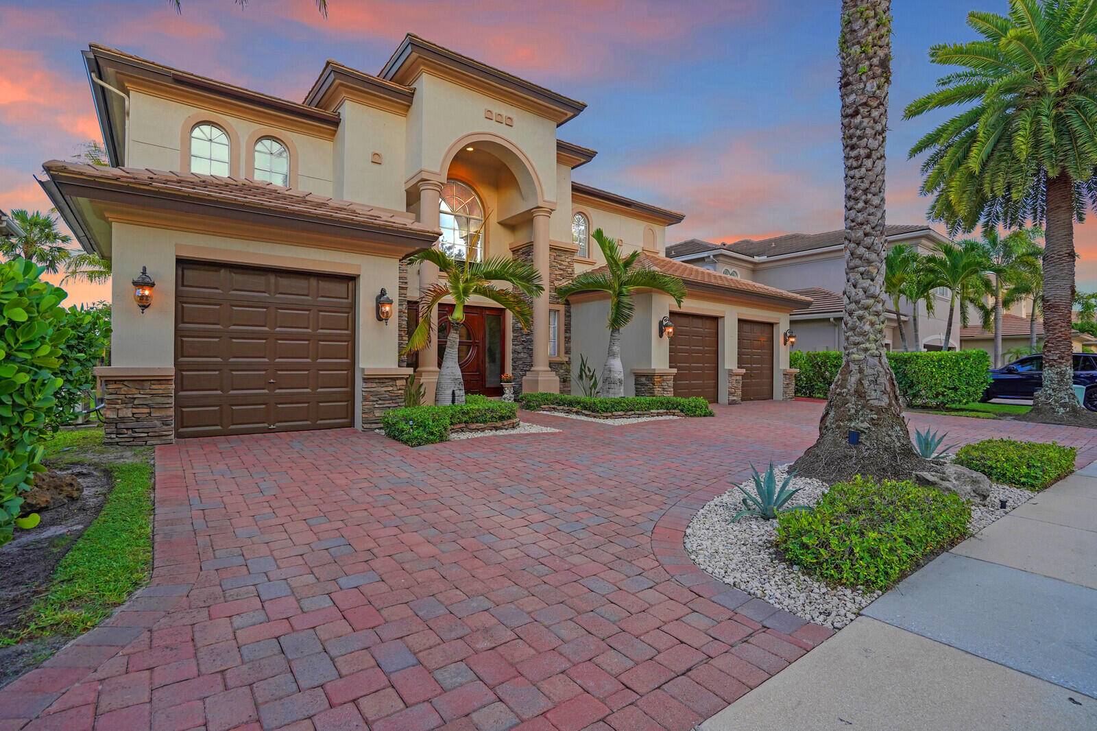 Welcome to the highly coveted, guard gated enclave of Wellington View, an elegant lakefront estate that seamlessly blends timeless architectural design with luxurious modern enhancements.