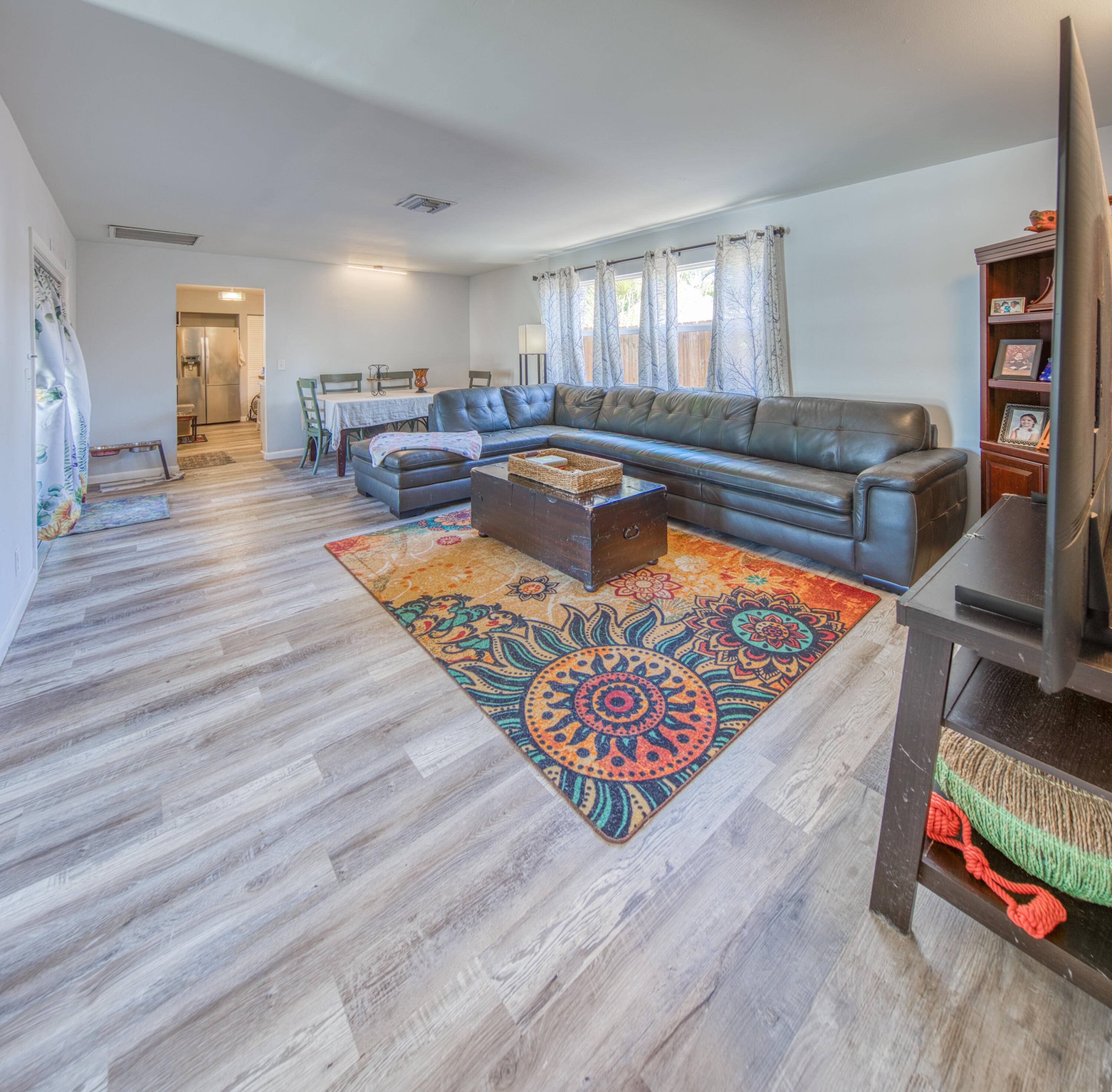 Gigantic dream home ! East side of Federal, walk to intracoastalUpdated, high end impact windows and doorsThis spacious, updated three bedroom, two bath residence features exceptionally large bedrooms, perfect for ...