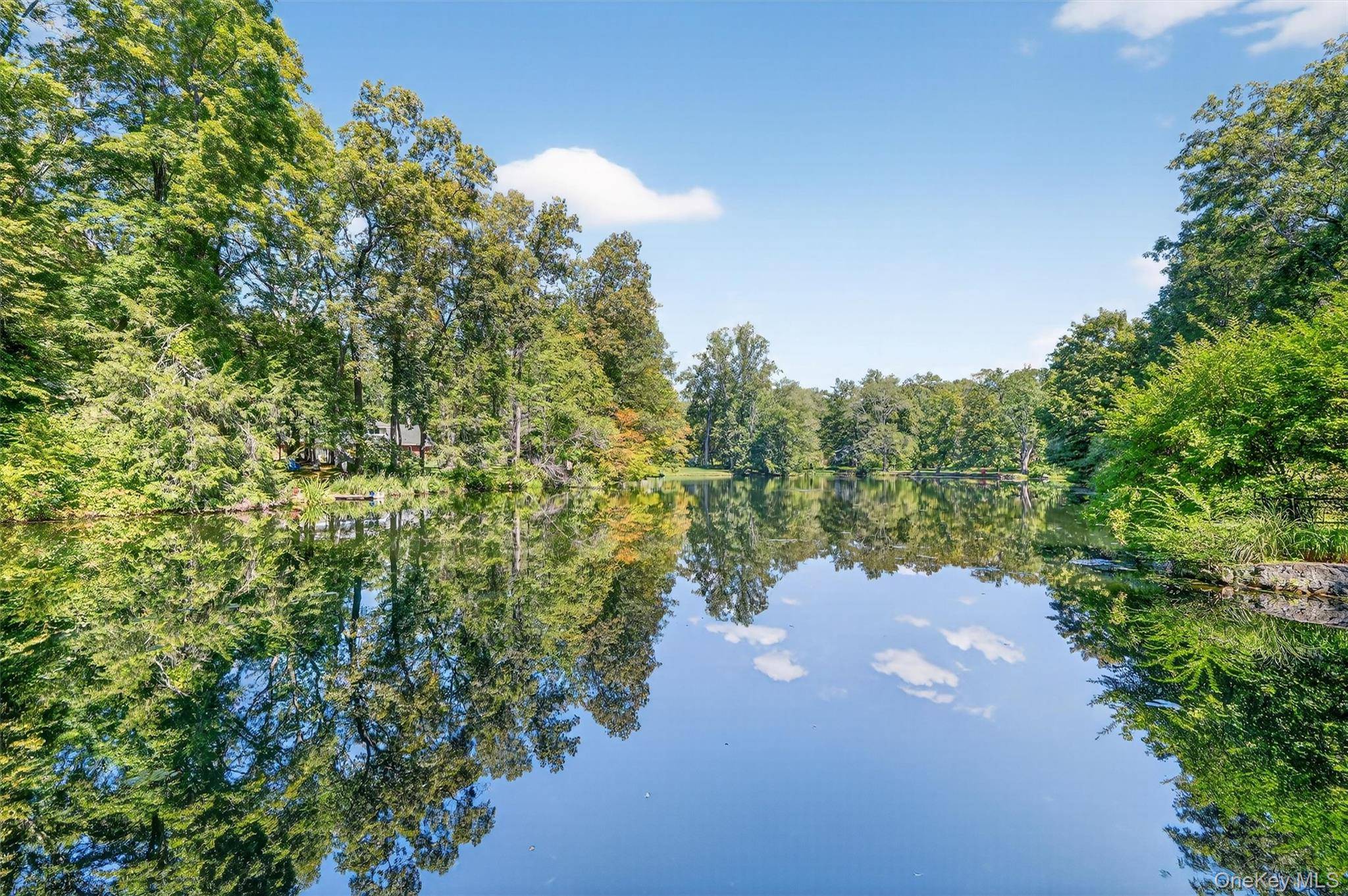 Set in a park like setting with gorgeous grounds, this home offers a rare combination of natural beauty and flexible living.